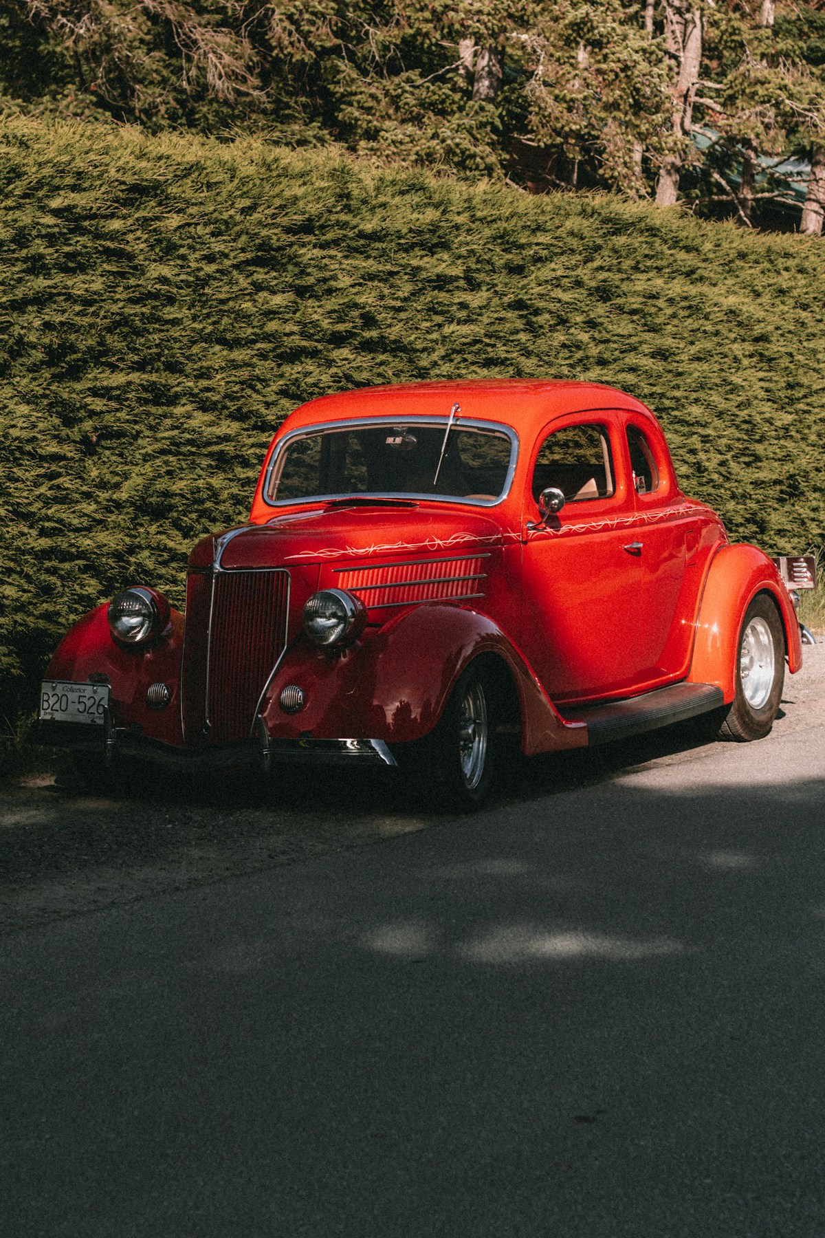 Photograph of a red vintage hot rod